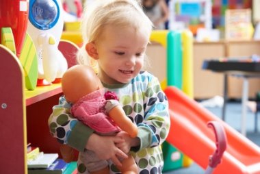 Young girl playing with toys