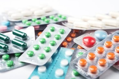 Pile of colorful medicine pills and capsules in blister packs